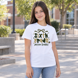 Jackson Heights Cobras Sixth Grade Bow Top modeled on a girl, white tee with bow accent and sixth grade Jackson Heights design