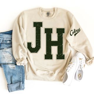 Jackson Heights JH Varsity top in sand, flat lay with jeans and sneakers