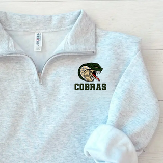 Jackson Heights Jr. Cobras Coiled Mascot NuBlend Fleece Quarter-Zip in Ash Grey, close-up of coiled cobra mascot graphic on left chest