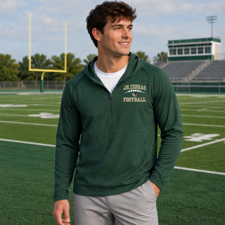 Male model wearing a Forest Green Jackson Heights Jr. Cobras Victory Arch Repeat half-zip hooded jacket
