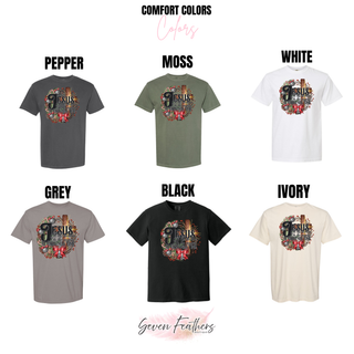 Comfort Colors color chart showing the Jesus At Christmas Time design on tees in pepper, moss, white, grey, black, and ivory