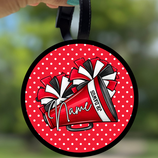 Jr. Dawgs cheer personalized bag tag with red polka dot background, cheerleading megaphone, pom poms, and custom name in script
