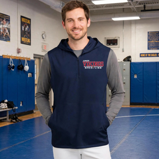 Man in a True Navy sleeveless hooded quarter-zip over a grey long sleeve shirt with the Junior Vikings Wrestling logo on the left chest, standing on a wrestling mat