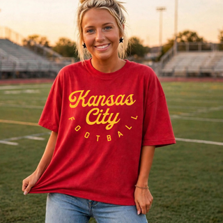 Kansas City Football Tee in red with gold script wordmark, lifestyle photo