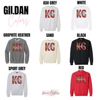 Gildan sweatshirt color chart for the Kansas City KC Santa Football Top showing ash grey, white, graphite heather, sand, black, sport grey, and red