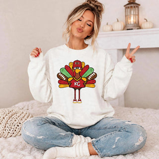 KC Football Turkey Graphic Top in White, turkey mascot wearing a red KC football jersey and cap