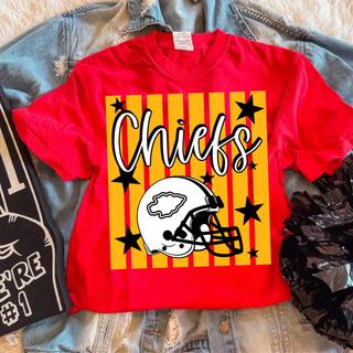 red adult top with gold stripes, black stars, and white kc helmet graphic laid over denim jacket
