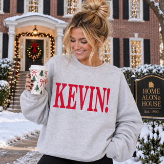 Kevin! Distressed Christmas Top in Heather Grey crewneck, styled on model with holiday decor