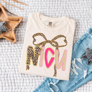 Leopard Bow NICU Graphic Top in ivory with leopard print bow and pink NICU lettering design

