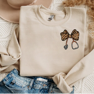 Folded sand crewneck with leopard print bow and stethoscope pocket design, adult unisex