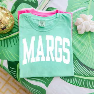 Chalky mint Comfort Colors tee with Margs varsity arch lettering folded flat lay