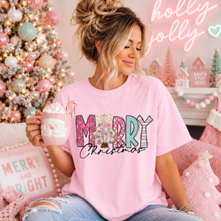 Merry Christmas Doodle Top - playful patterned "Merry Christmas" lettering with a pink bow and Christmas tree accent on a pink Comfort Colors tee