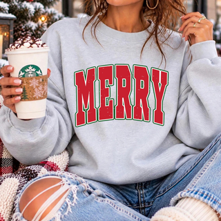 Merry varsity-style design in bold red letters with a green and white outline on a heather grey crewneck sweatshirt