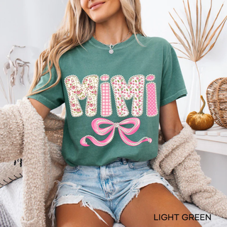  Light green Comfort Colors tee with Mimi floral gingham polka dot pearl lettering and pink bow design front view
