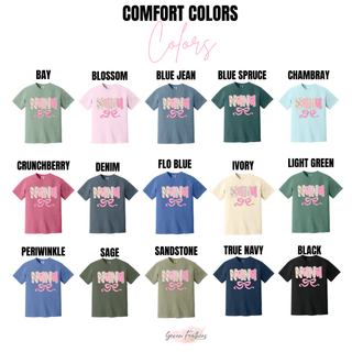 Nana Floral Bow tee color swatch showing bay, blossom, blue jean, blue spruce, chambray, crunchberry, denim, flo blue, ivory, light green, periwinkle, sage, sandstone, true navy, and black