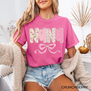  Crunchberry Comfort Colors tee with Nana floral gingham polka dot pearl lettering and pink bow design front view