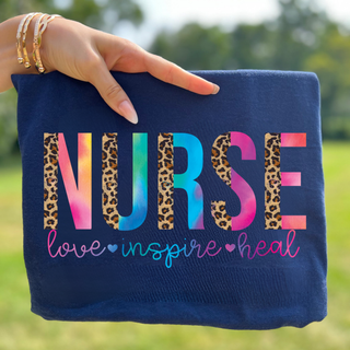 True navy shirt with NURSE rainbow tie dye and leopard letters plus love inspire heal script, adult unisex