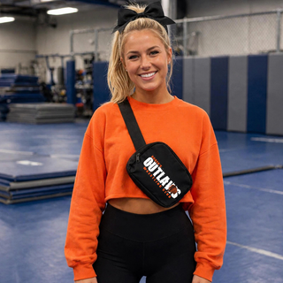 Model wearing a black Ogden's Outlaws Wrestling Club belt bag crossbody
