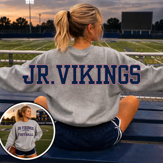 Oversized Jr Vikings Football sport grey crewneck front with JR VIKINGS FOOTBALL logo model on Seaman field