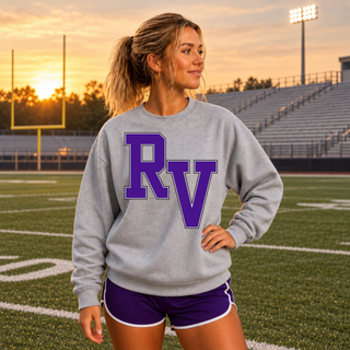Woman wearing the Sport Grey Royal Valley Panthers crewneck sweatshirt from the front, showing the purple RV initial on the front chest