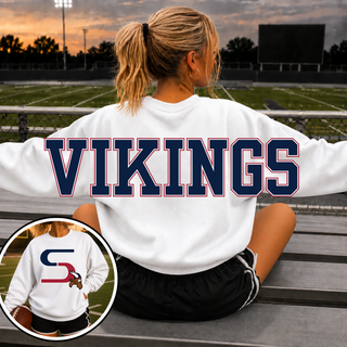 Oversized Seaman Vikings S Logo White Crewneck back view with VIKINGS lettering, front S logo inset, on stadium bleachers