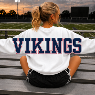 Oversized Seaman Vikings S Logo White Crewneck front close-up with S logo and Viking head, model holding a football
