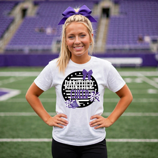 Blonde cheerleader with purple bow wearing white Panther Cheer t shirt with black polka dot circle white and purple text purple bow pom poms and megaphone on football field