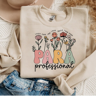 Sand crewneck flat lay with PARA professional wildflower design and TEACH THEM LOVE THEM WATCH THEM GROW text
