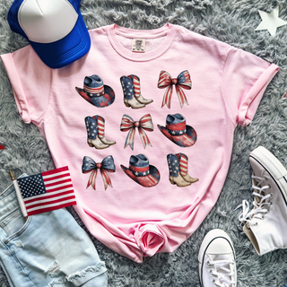 Blossom pink Comfort Colors tee with patriotic cowboy boots and bows graphic featuring a nine piece collage of red white and blue American flag cowboy hats, boots, and bows