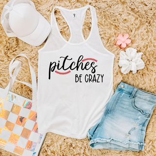 White Next Level racerback tank flat lay with pitches BE CRAZY baseball stitch script design
