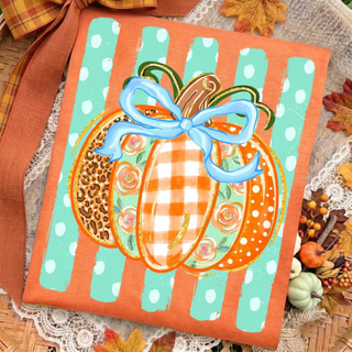 plaid pumpkin leopard bow top in orange styled with fall decor
