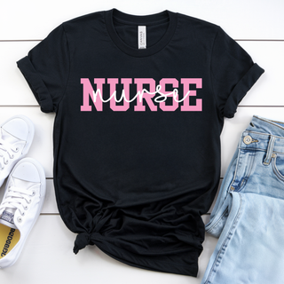 Black Bella Canvas Pop of Pink Nurse Graphic Top with bold pink varsity NURSE lettering and white script overlay laid flat with jeans and sneakers
