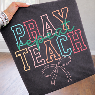 Pepper adult Pray Repeat Teach Bow Comfort Colors graphic tee with colorful varsity letters