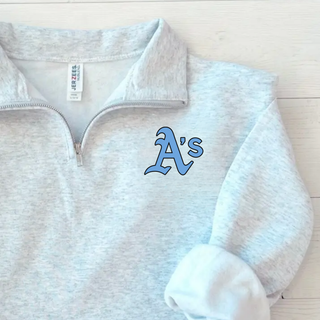 Prime Athletics Baseball A's Pocket Fleece Quarter-Zip close-up of the light blue A's left-chest pocket design