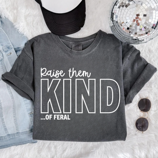 Pepper Comfort Colors tee flat lay with raise them kind ...of feral design, denim jacket, black hat, disco ball, sunglasses
