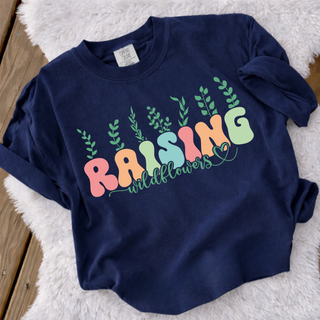 Navy Comfort Colors crewneck with raising wildflowers colorful bubble letters and greenery design, folded flat lay