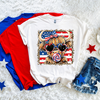 White graphic tee with patriotic highland cow American flag leopard border design front view