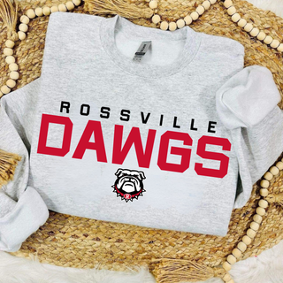 Sport grey Rossville Dawgs Bold Red Classic crewneck with Rossville Dawgs text and bulldog mascot on wicker surface
