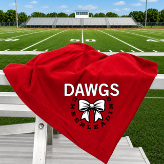 red stadium blanket draped over bleachers with Dawgs cheerleading design: white DAWGS text above white bow, CHEERLEADING text curved around bow