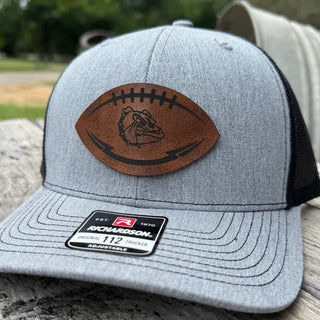 Angled view of Rossville Dawgs football leather patch trucker hat