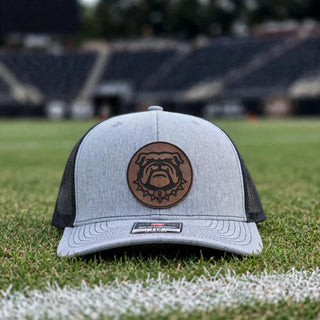 Rossville Dawgs leather circle patch Richardson 112 trucker hat on a football field