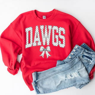 Red crewneck with polka dot Dawgs block lettering and polka dot bow, flat lay styled with distressed denim jeans on white background
