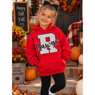 Model wearing a red hoodie with a black and white polka dot varsity R and Rossville Dawgs script across the front