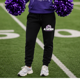 Cheerleader wearing black Royal Valley Jr. Panthers Cheer Pom Core Fleece Joggers on a football field.