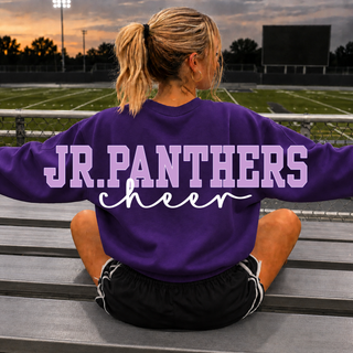 Model wearing a purple Royal Valley Jr. Panthers cheer crewneck with front pom graphic