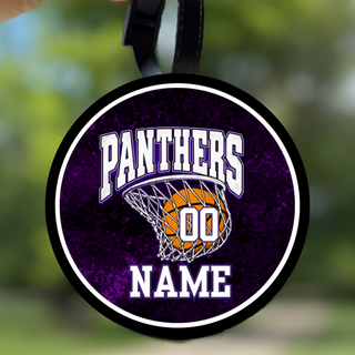 Round black bag tag with a white border and purple marbled background showing Panthers lettering over a basketball in a net with a name and number placeholder