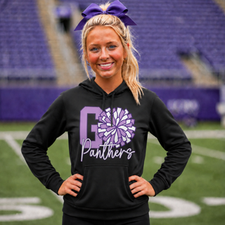 Woman wearing black Royal Valley Panthers cheer pom performance hoodie on football field