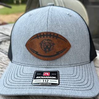 Front view of Royal Valley Panthers Richardson 112 trucker hat with leather football patch
