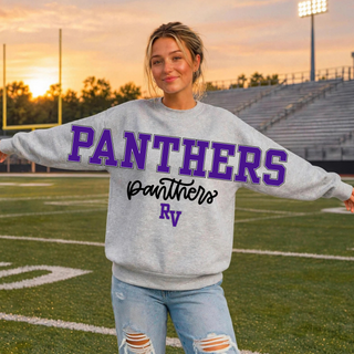 Woman wearing an oversized Sport Grey Royal Valley Panthers crewneck sweatshirt with a stacked PANTHERS block letter, panthers script, and RV initial graphic on the front