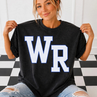 Model wearing a black Rural WR petite polka dot top